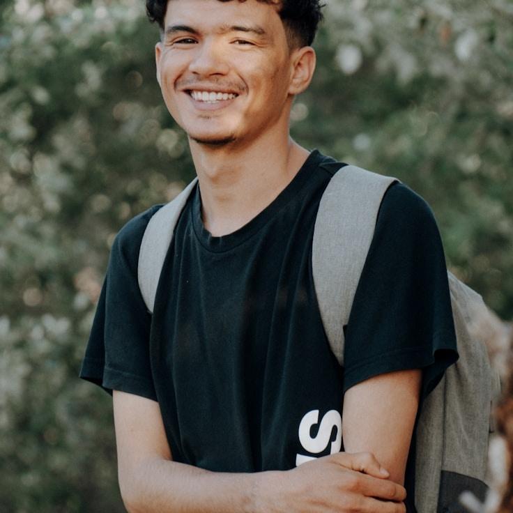 Anika Rao, Lead Design Curator at Market Analysis Platform, reviewing corporate floral arrangements